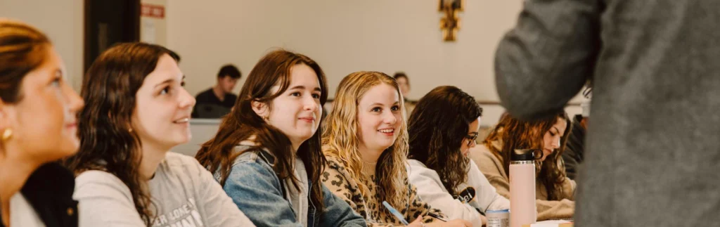 Students sitting in the front during a classroom discussion.