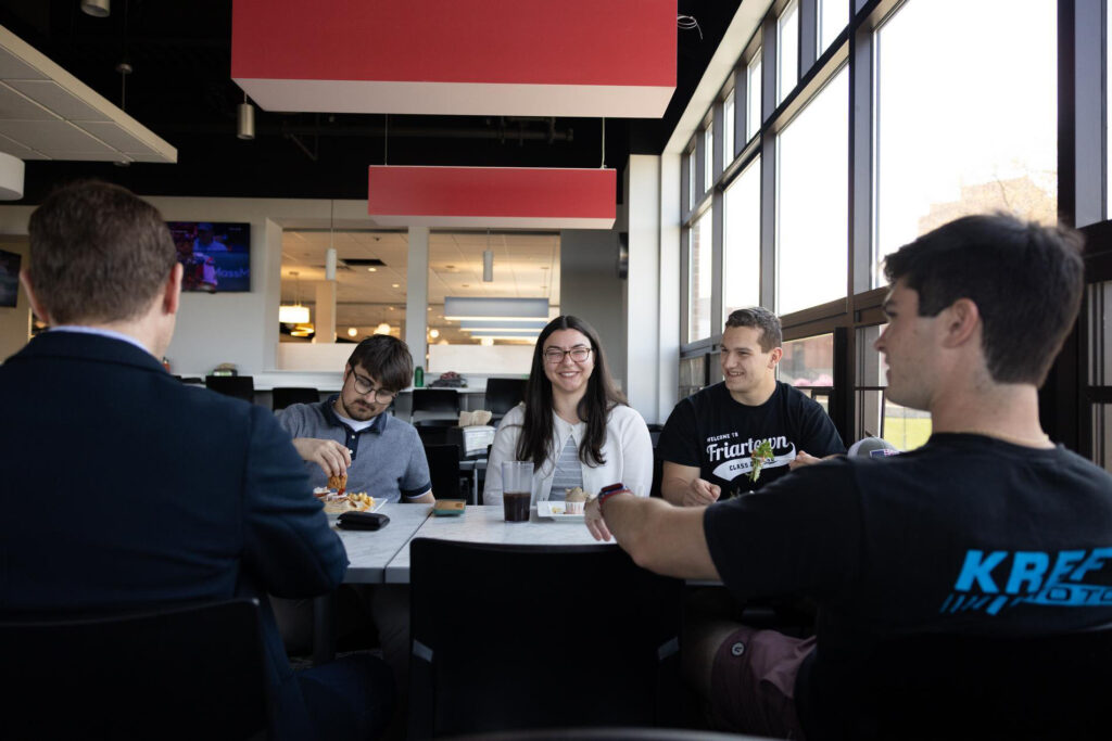 Philosophy students enjoying a conversation in Ray Dining Hall.